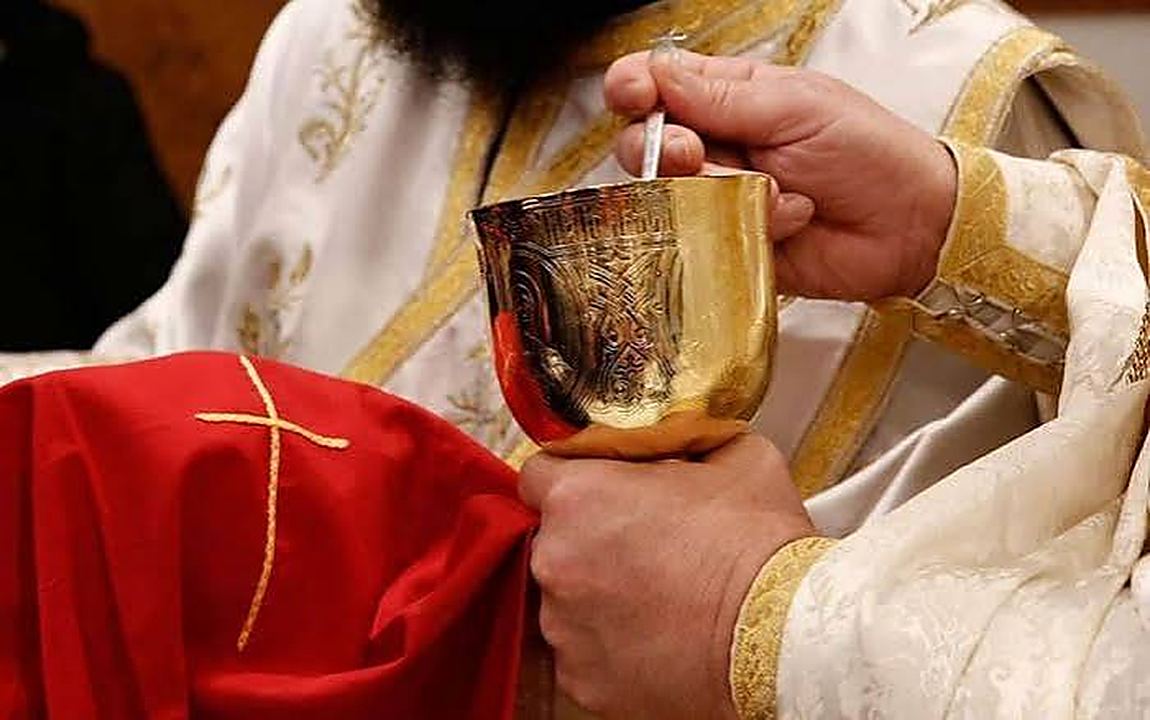 The chalice raised